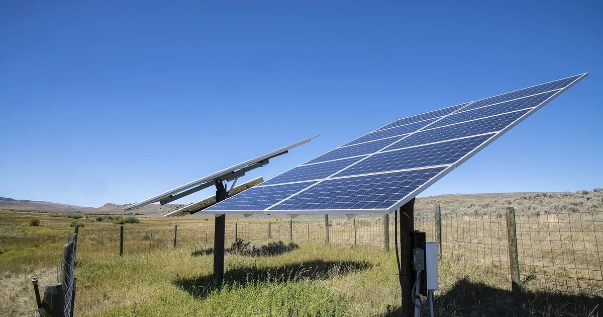 Solar panels powering a farm water pump